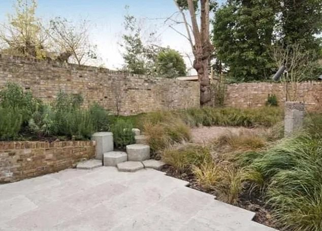 Osman's new four-storey mid-terrace property appears to be a somewhat conventional Georgian home from the front, but our pictures show it's been given a spectacular makeover