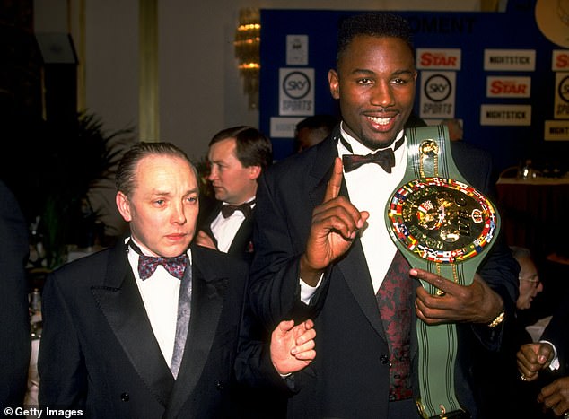 Maloney, then known as Frank, pictured with undisputed heavyweight champion of the world, Lennox Lewis