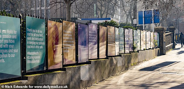 The boards stretch the 250 metre length of Denmark Hill outside King's College Hospital and Maudsley Hospital