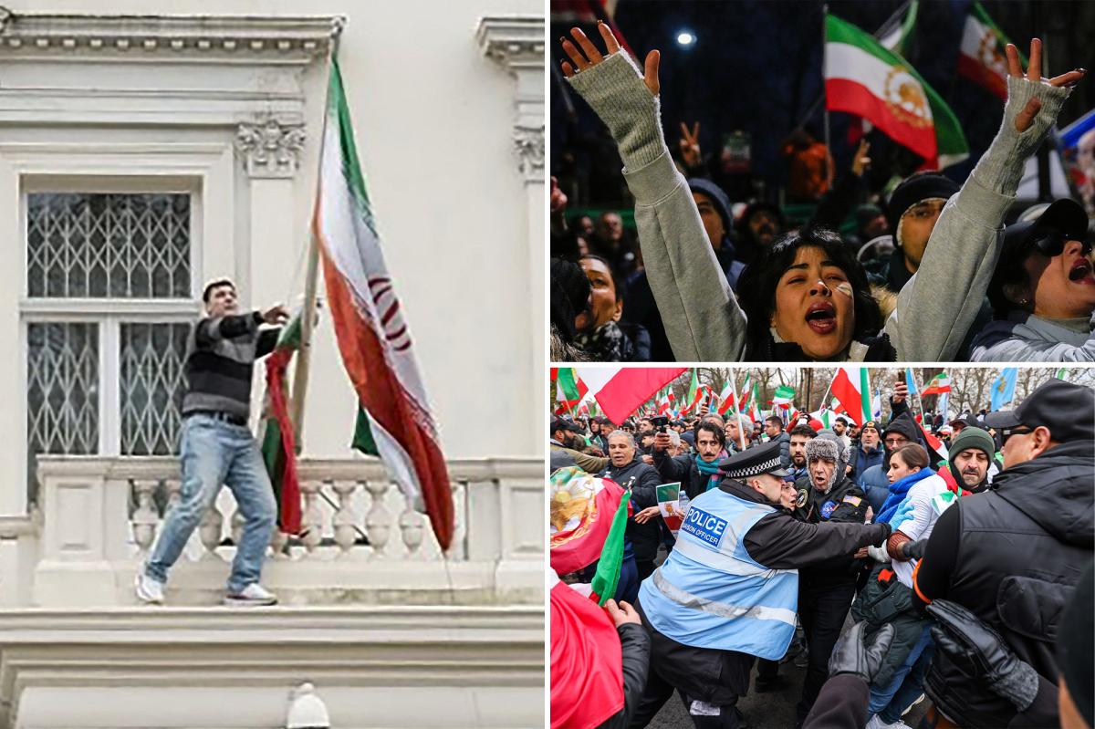 Protester scales Iranian Embassy in London, tears down regime flag, hoists pre-revolution symbol
