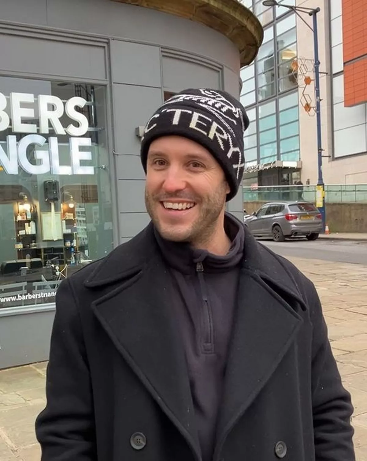 Music producer interviewed about new years resolutions on a Manchester street