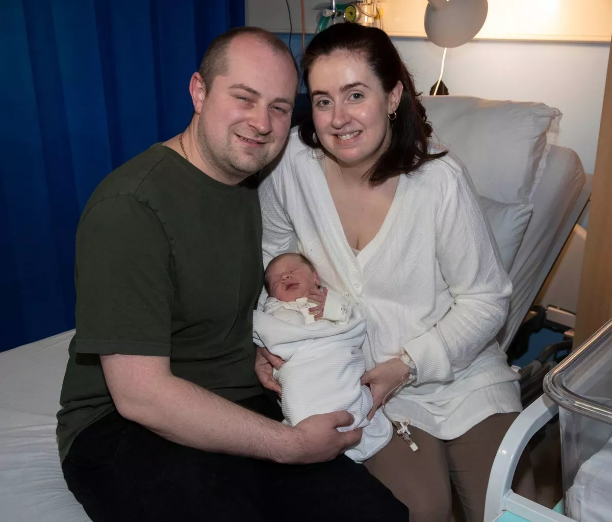 Kyle and Emily Robertson with baby Vincent, the second child born in Glasgow this year