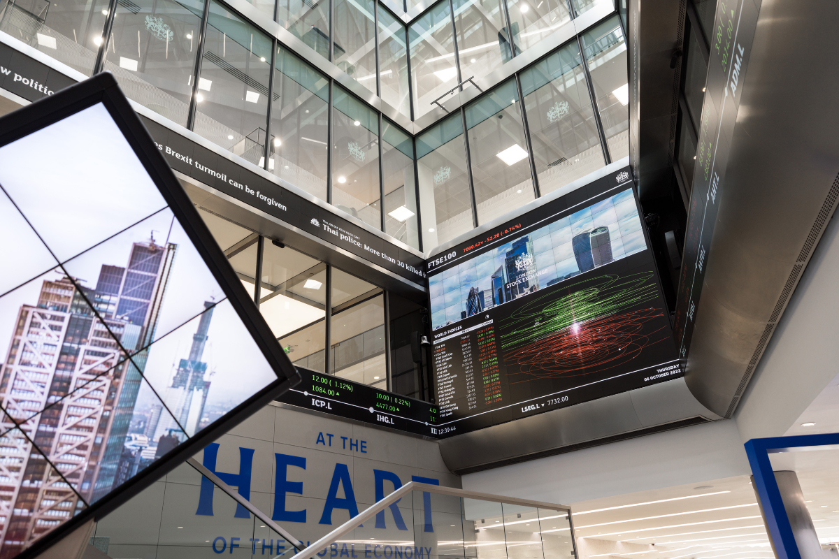 London Stock Exchange building exterior with financial district skyline, symbolizing global market activity and economic t...