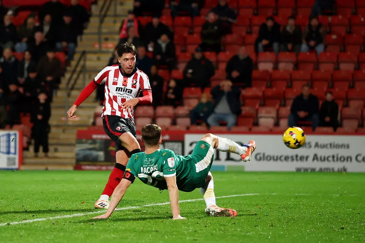 CHELTENHAM, ENGLAND - NOVEMBER 10: Isaac Hutchinson of Cheltenham Town scores his team's first goal during the Sky Bet League Two match between Cheltenham Town and Notts County FC at The EV Charger Points Stadium on November 10, 2025 in Cheltenham, England. (Photo by Dan Istitene/Getty Images)