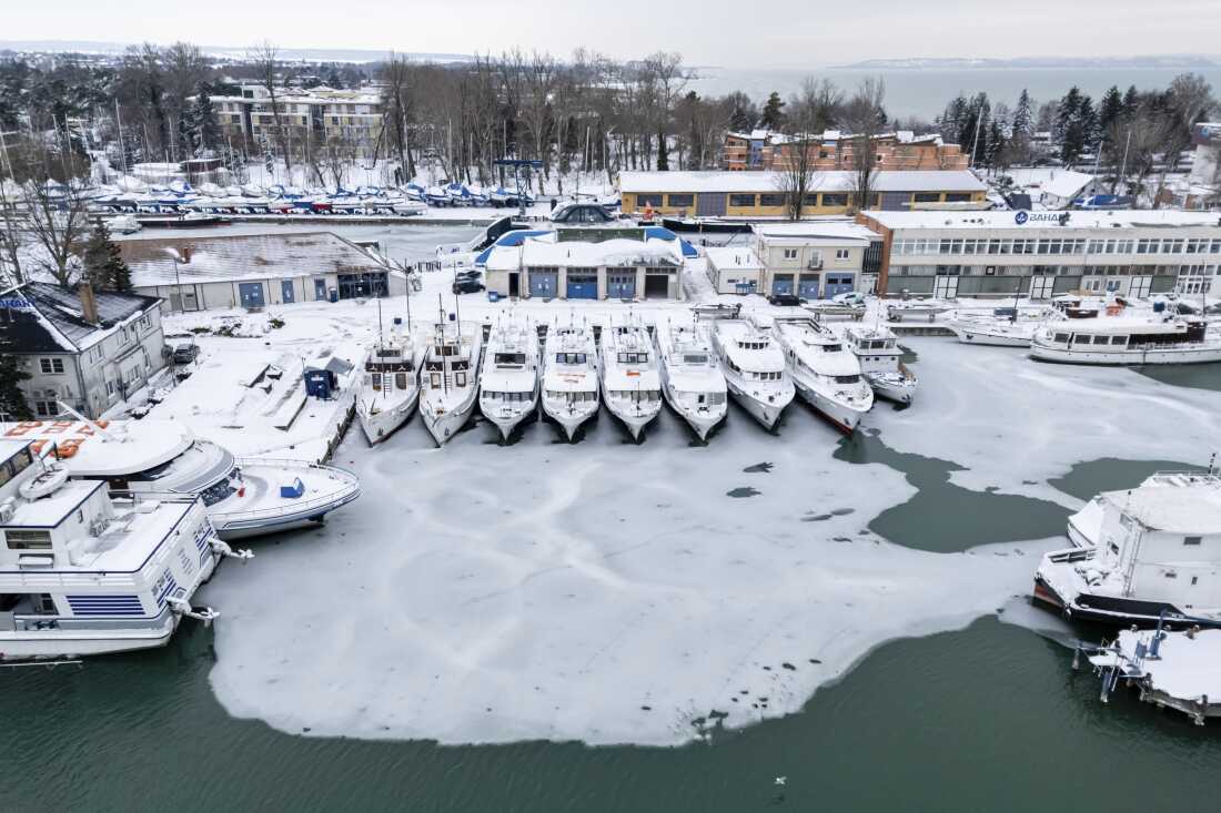Ice builds up at a pier of Lake Balaton at Siofok, Hungary, Wednesday, Jan. 7, 2026. 