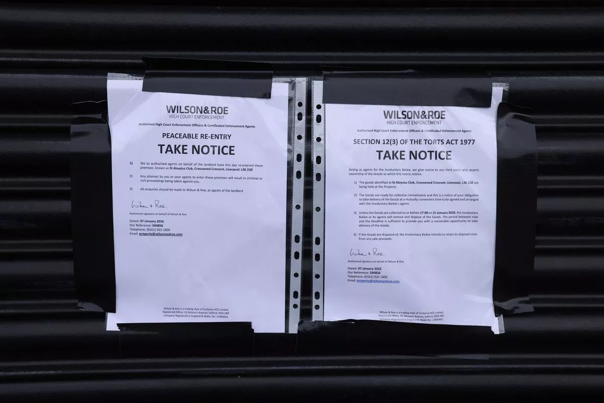 A notice on the shutters of St Aloysius Social and Community club