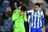 thumbnail: Sheffield Wednesday's Northern Ireland goalkeeper Pierce Charles (left) is comforted by team-mate Gabriel Otegbayo while walking off the pitch on Saturday
