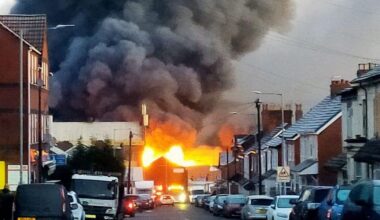 Huge inferno sends smoke billowing over city after 'explosions' heard