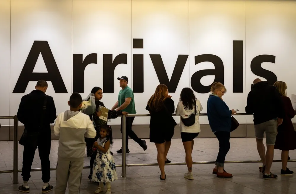 People waiting at Arrivals London Heathrow