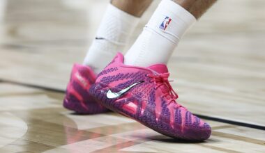 Getty Images logo on office building fa&ccedil;ade reflecting a modern city skyline at dusk, highlighting corporate presence and...