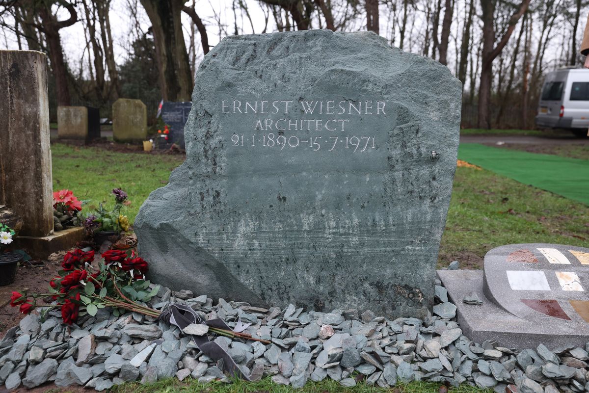 The refurbished gravestone and memorial stone