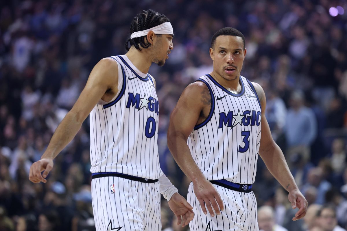 GettyImages 2256933277 showing a professional business meeting with diverse team members discussing strategy in a modern o...