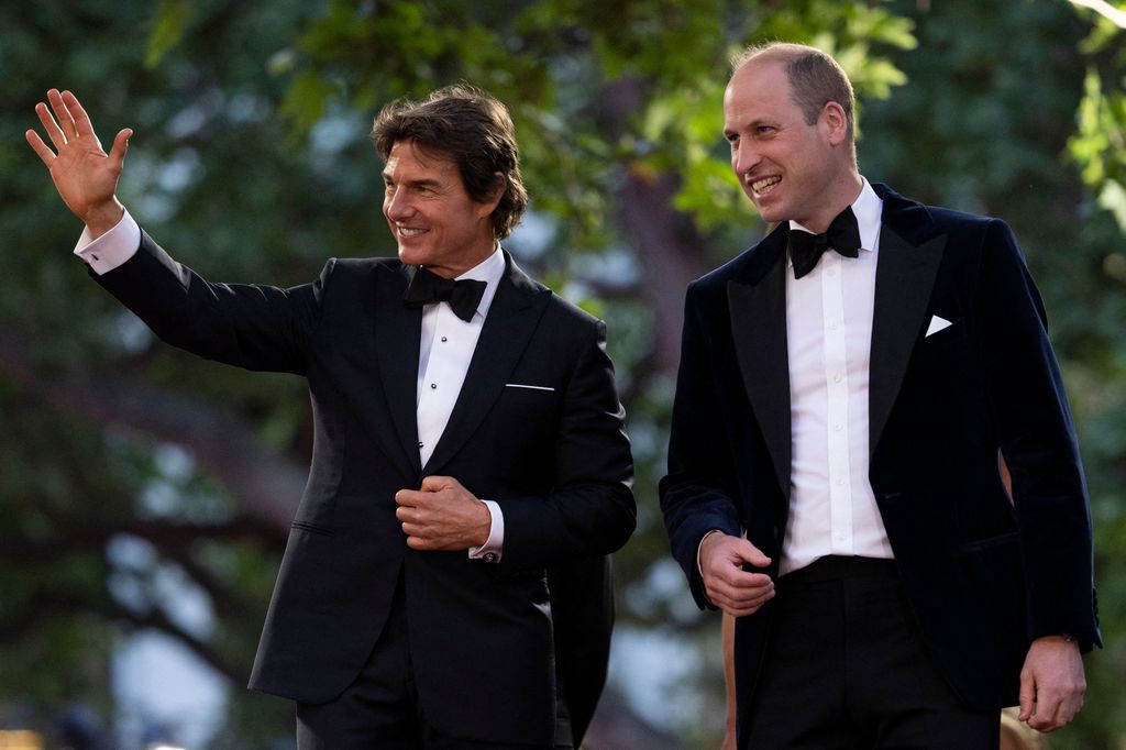 Britain's Prince William, Duke of Cambridge (R) is accompanied by US actor Tom Cruise
