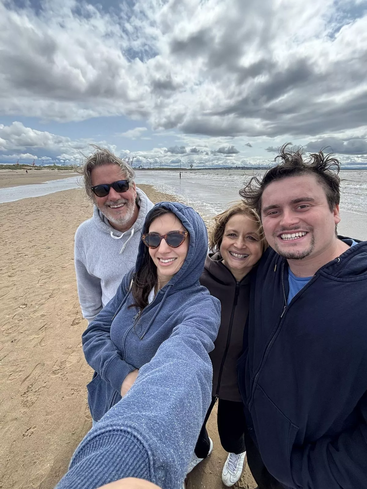 Alex with his mum Indira, dad Ian and sister Isabella