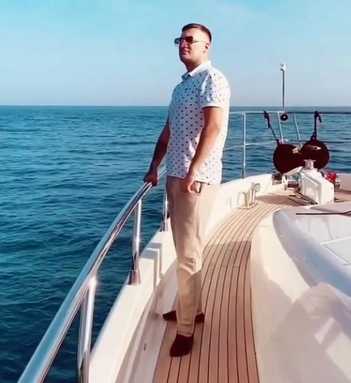 A picure of Cagdas Baybasin standing on the deck of a boat out at sea