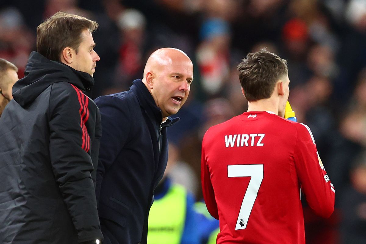 LIVERPOOL, ENGLAND - DECEMBER 03: Liverpool coach Arne Slot makes a point to Florian Wirtz during the Premier League match between Liverpool and Sunderland at Anfield on December 03, 2025 in Liverpool, England. (Photo by Chris Brunskill/Fantasista/Getty Images)