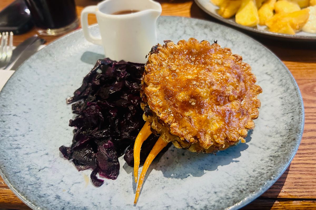 The venison and ale pie with mashed potato, red cabbage, baby carrots and a red wine, cranberry and rosemary gravy 