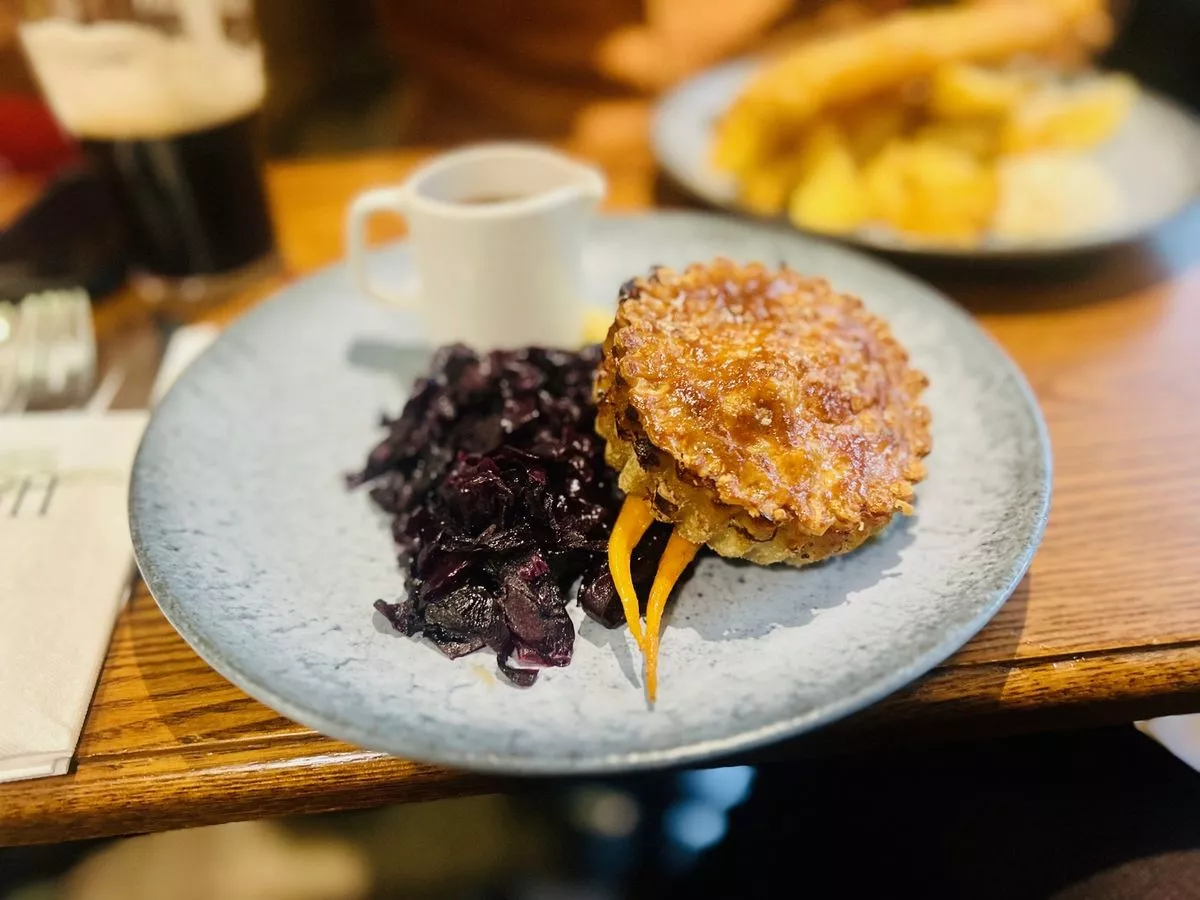 The venison and ale pie with mashed potato, red cabbage, baby carrots and a red wine, cranberry and rosemary gravy 