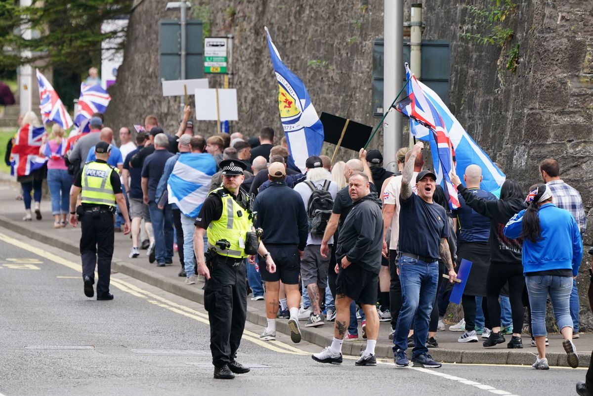 People demonstrating at an Abolish Asylum System protest outside the Radisson Hotel in Perth