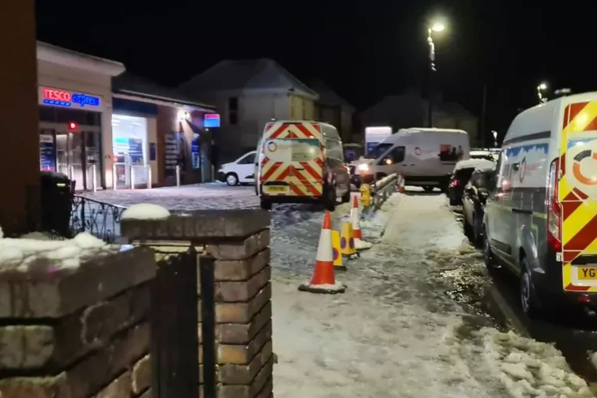 The image shows a number of vans outside the Tesco Express store