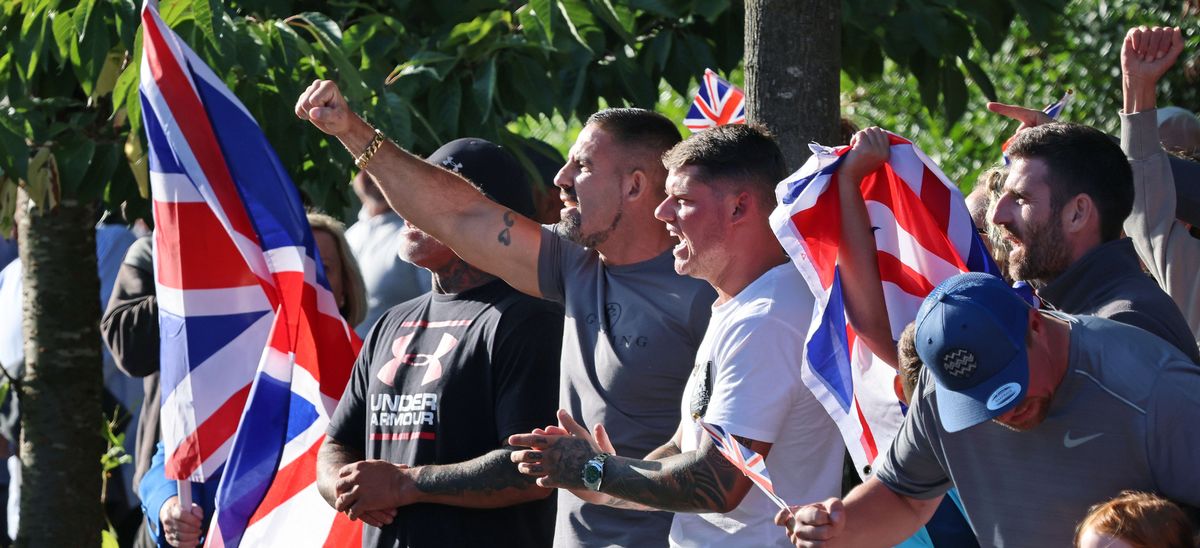 Ferguson (white t-shirt) outside the Kings Gap Hotel in Hoylake, Wirral.