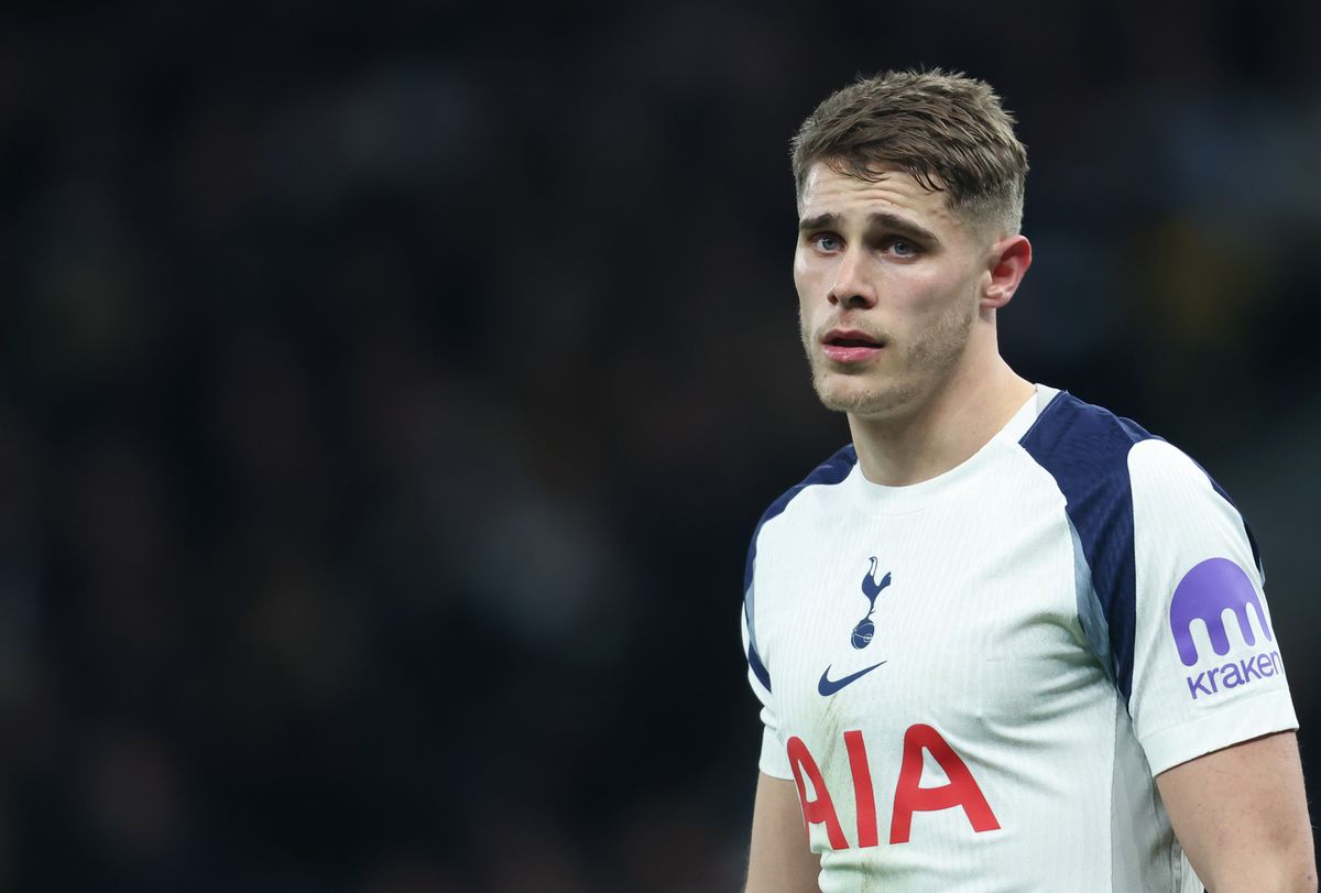 Micky van de Ven in Tottenham Hotspur home colours looks on.