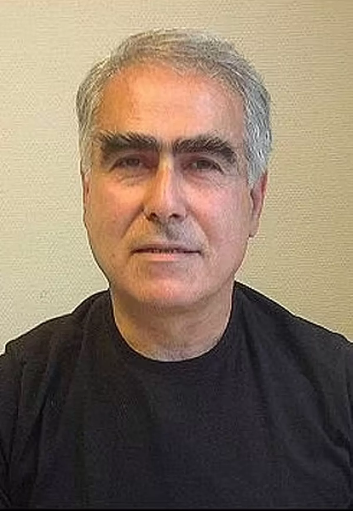 A picture of Huseyin Baybasin wearing a black top