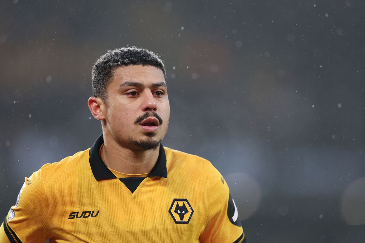 Andre in Wolverhampton Wanderers home colours looks on in the snow with his mouth open.