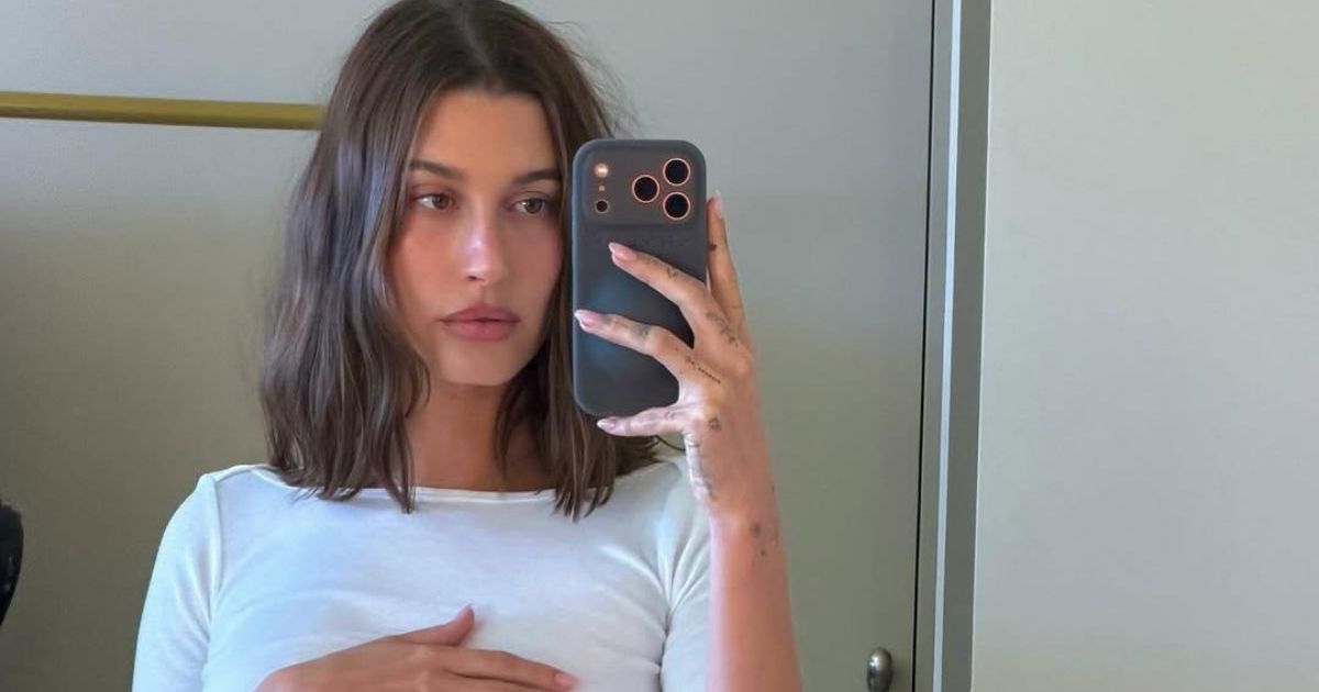 Hailey Bieber Dons Just a Blanket While Posing in Bed