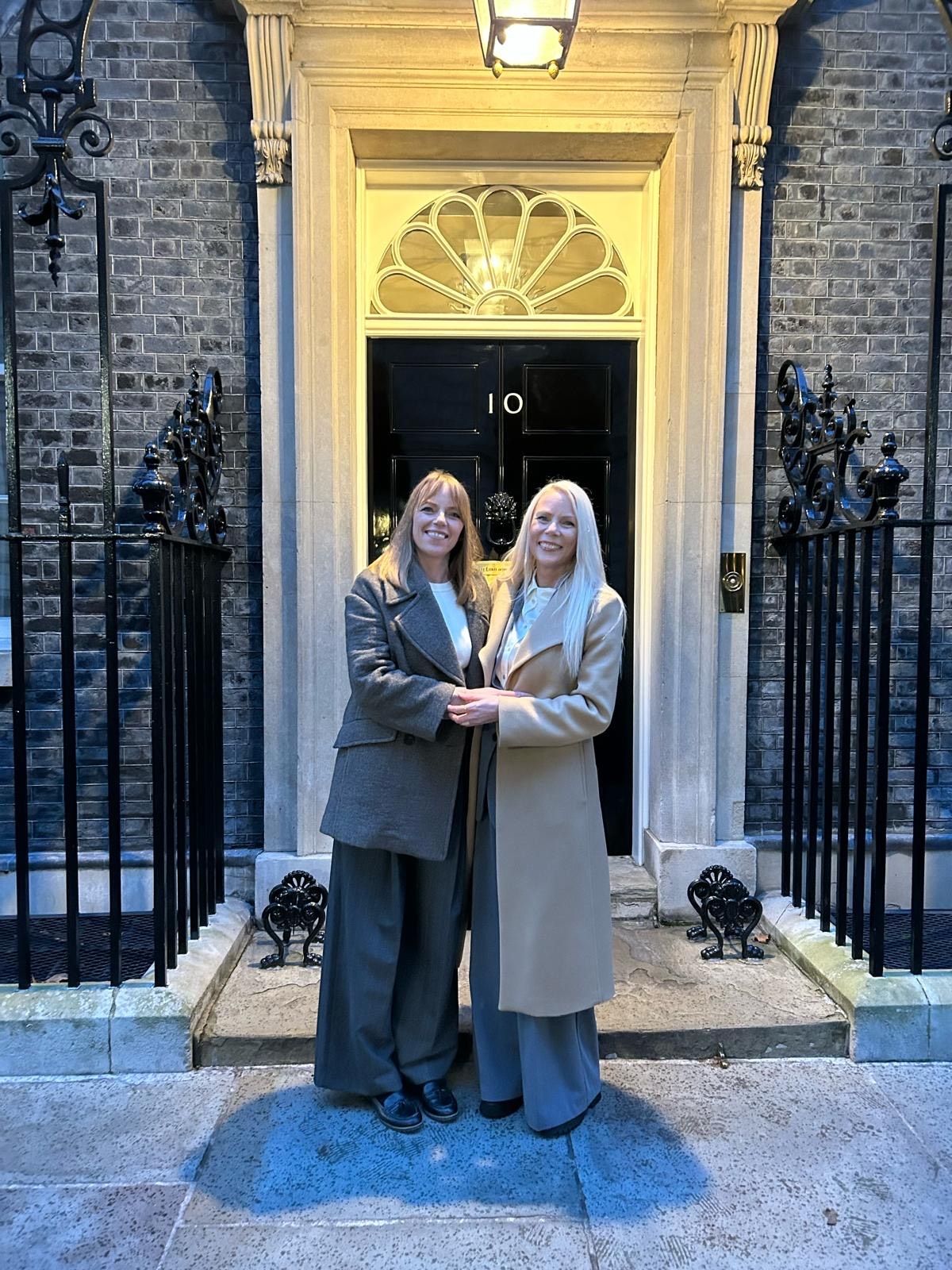 Stephanie's sisters Janette Hall, (right) and Diane Taylor (left)  stand and embrace outside the front door of Number 10 Downing Street