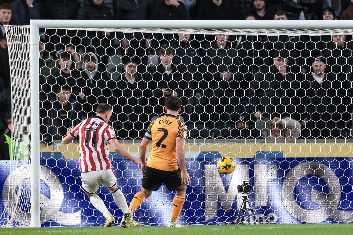 Robert Bozenik scored the opener at Hull City as Lewie Coyle looks on