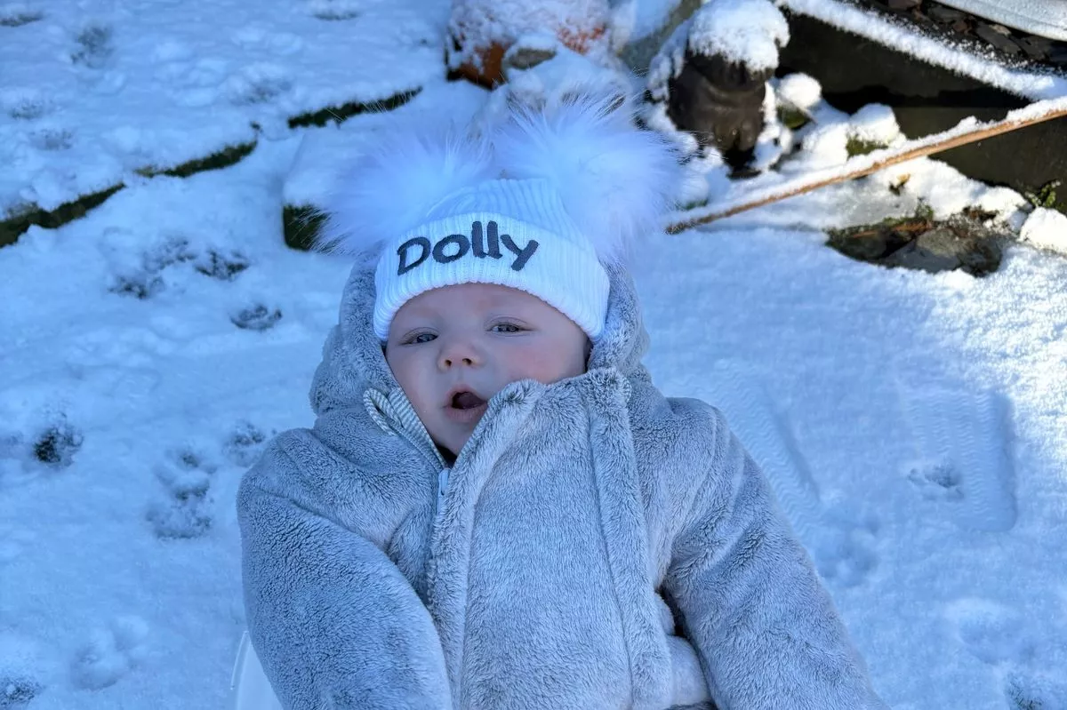 Dolly Hart is described as a "really funny and happy baby" 
