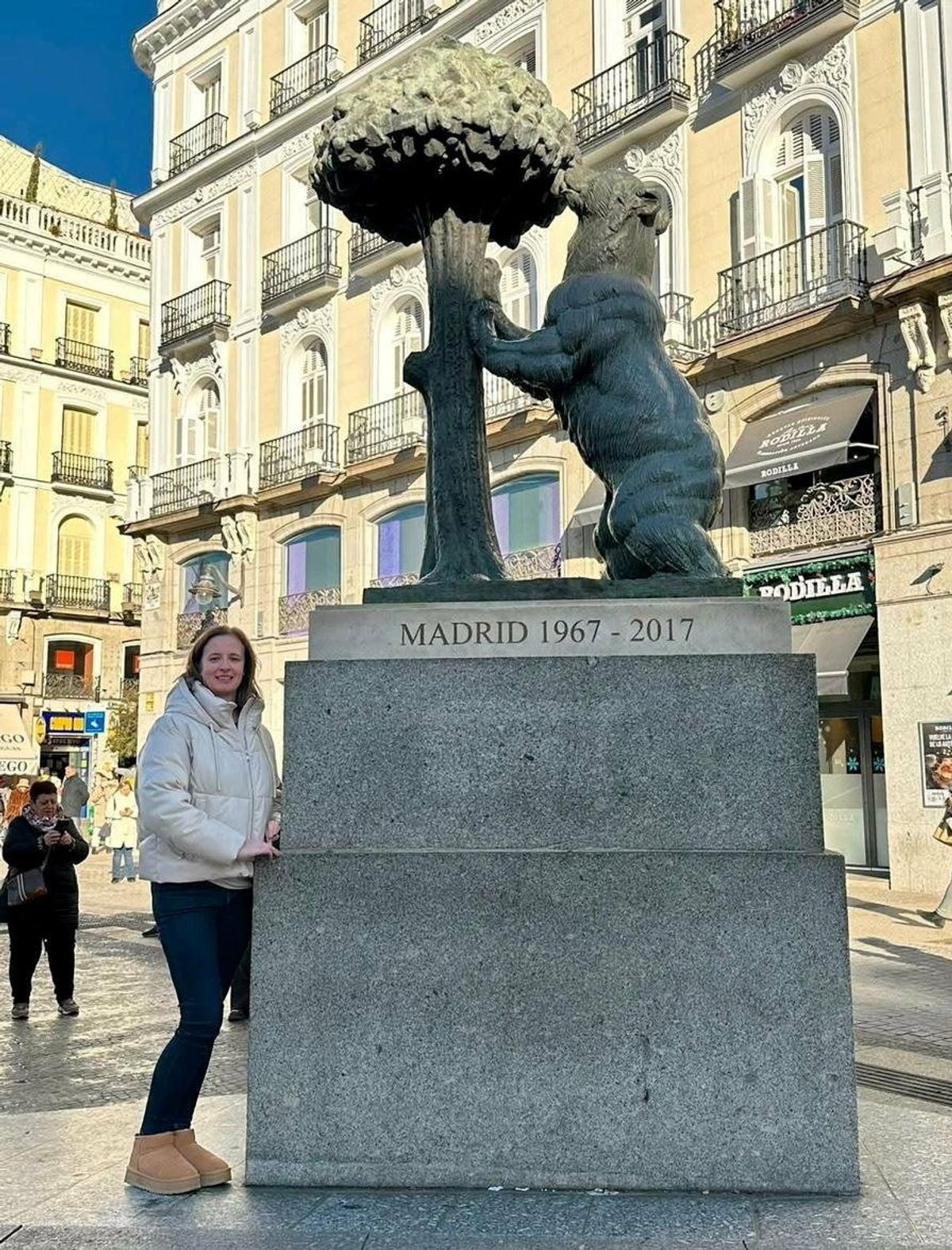 Michelle Ingram standing next to a statue in Madrid