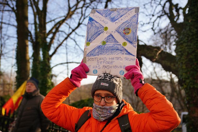 People attend a protest outside the US consulate in Edinburgh
