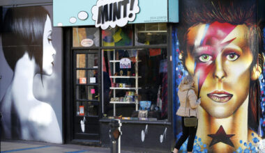 A woman touches a mural of David Bowie in Sheffield