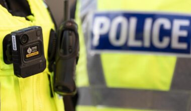 Armed police lock down Edinburgh street as man taken to hospital