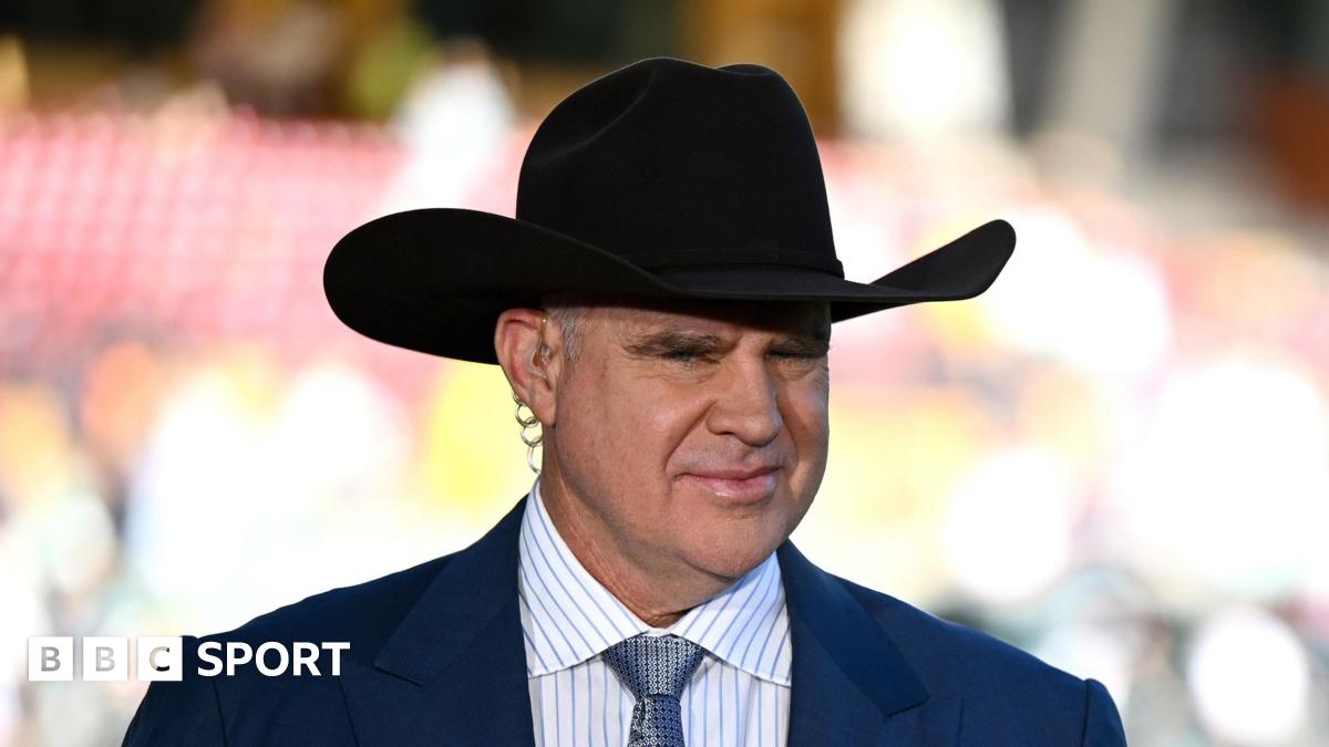Matthew Hayden wearing a large hat while offering punditry on the Ashes