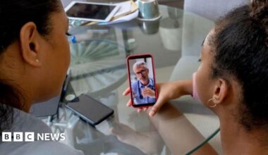 Patient using phone for remote consultation