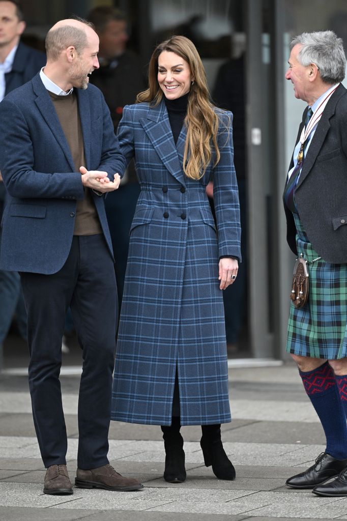 Prince William and Kate laughing in blue tartan coat