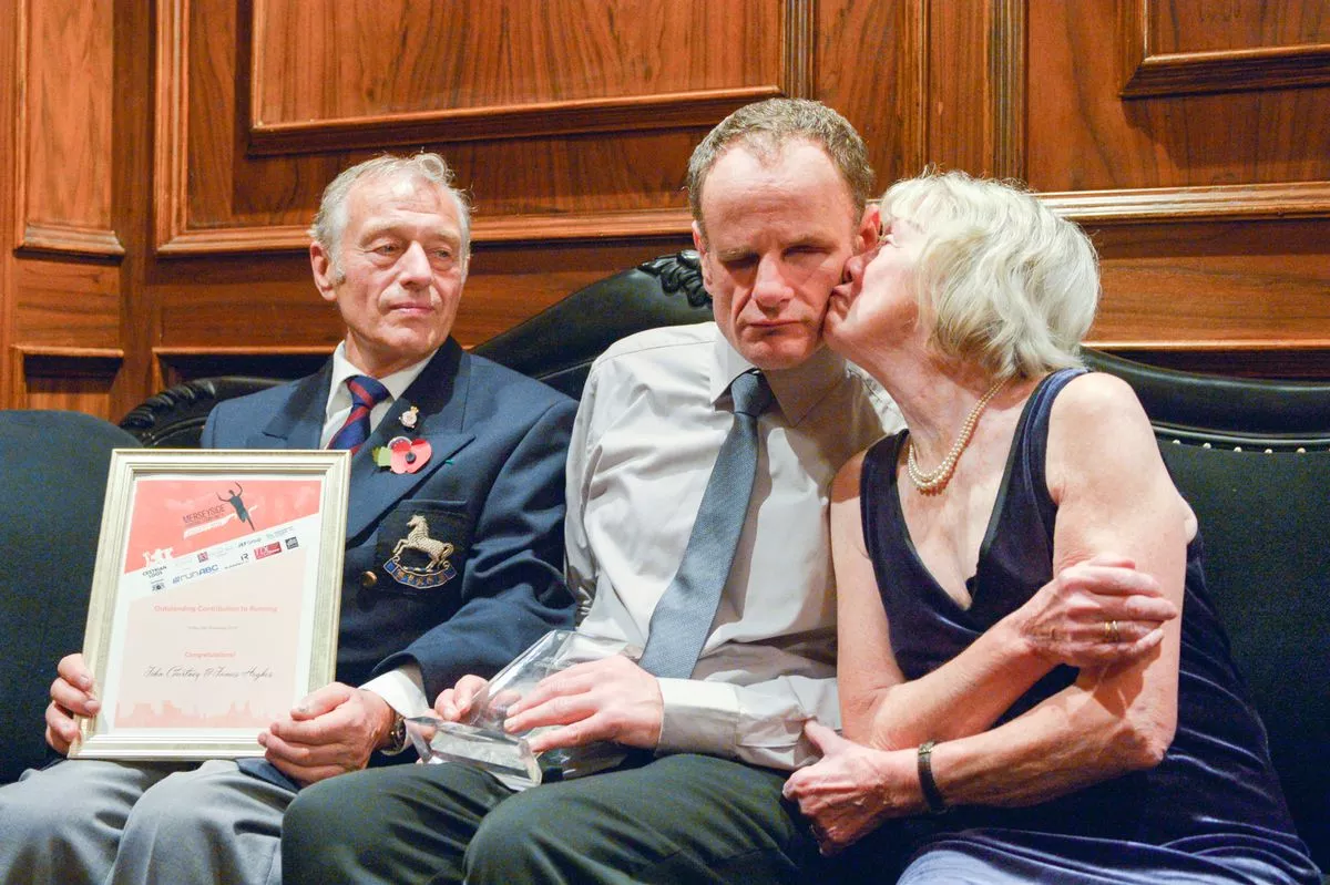 John and his wife Sylvia Courtney with son James celebrating an achievement together