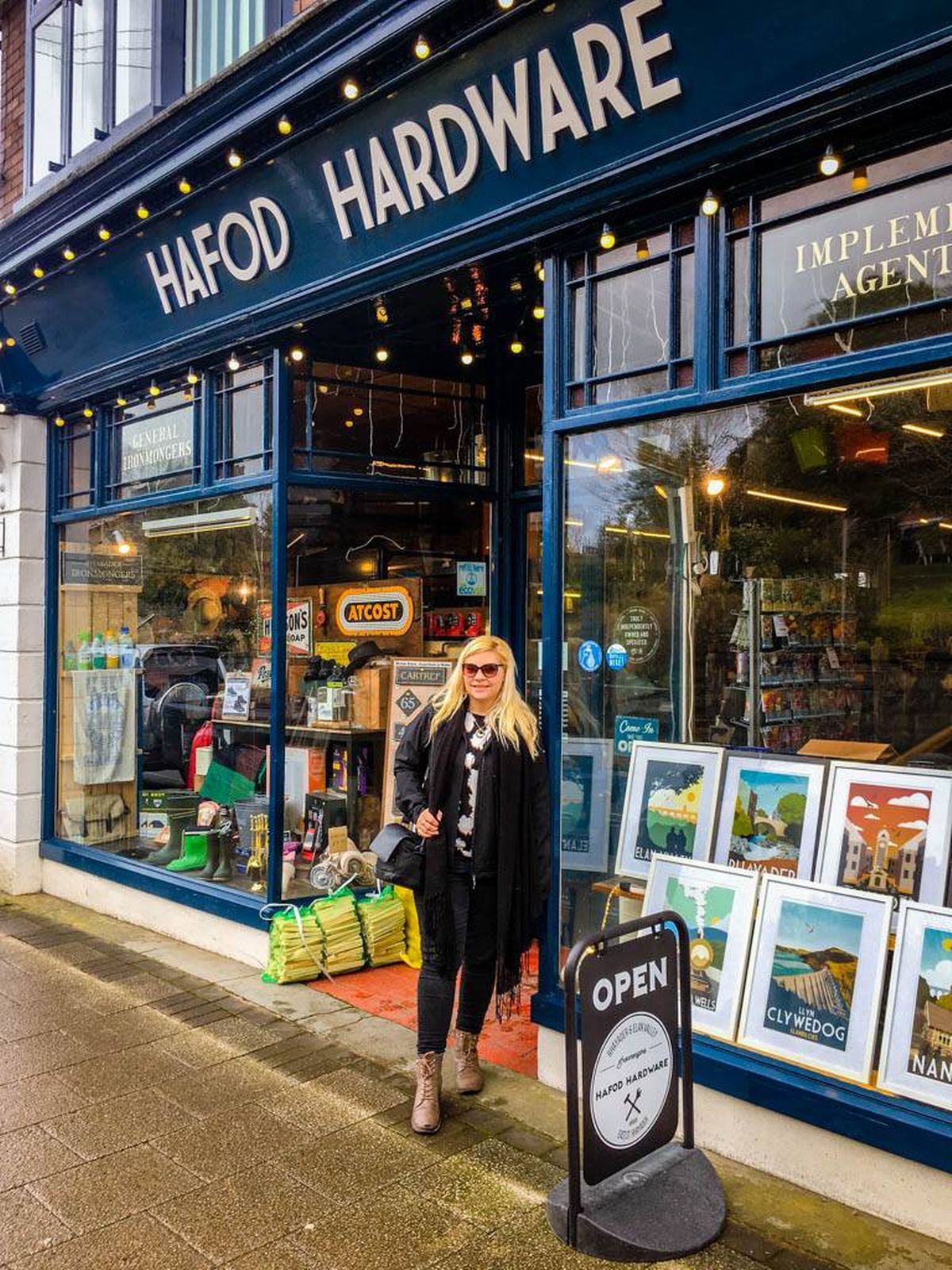 A woman stood near a shop