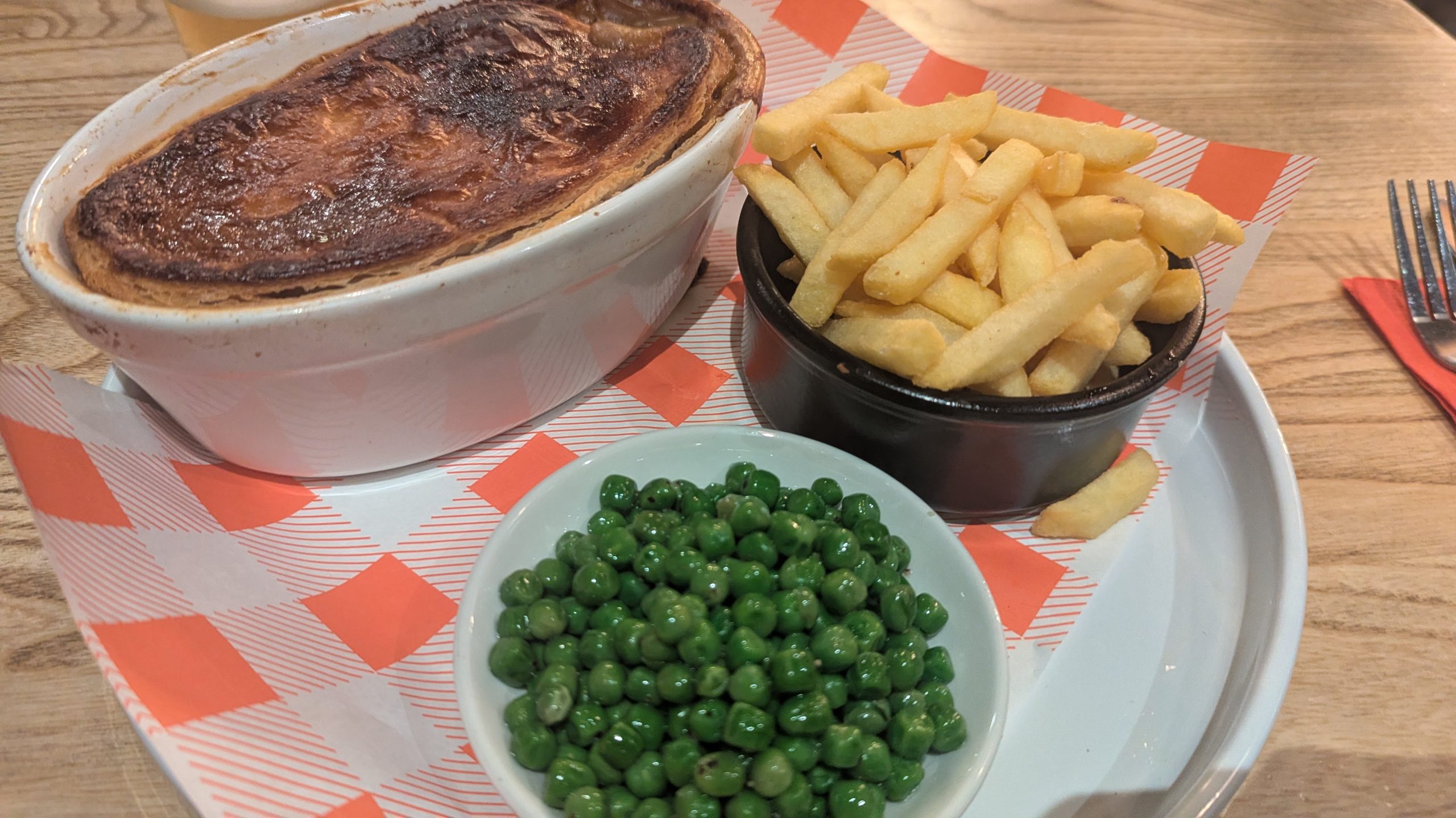 Steak pie, chips and peas
