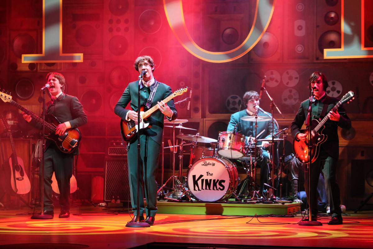 A previous production photo of Sunny Afternoon - 4 people on stage, playing different instruments