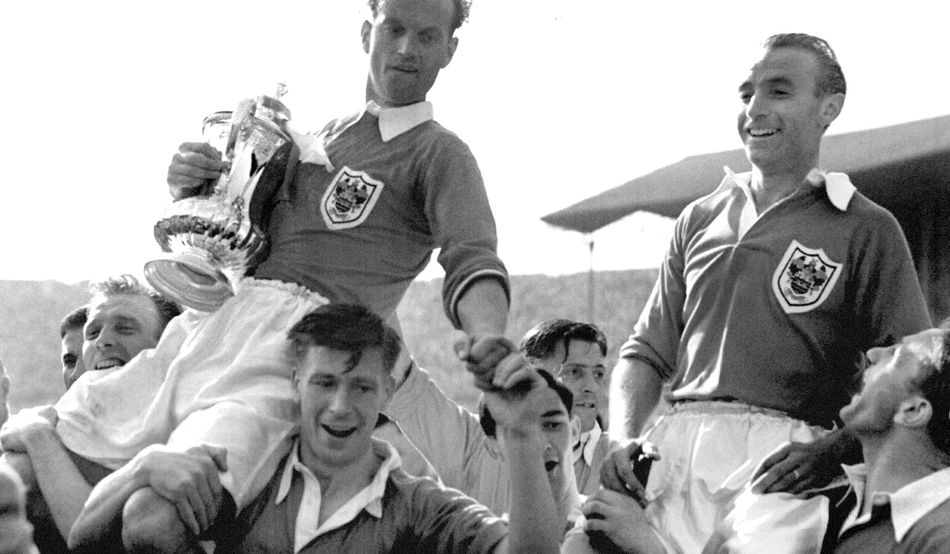 He's done it: Matthews (right) and teammates with the trophy. Photo by PA Images / Alamy