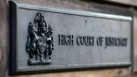 Getty Images Close up of the iron High Court of Justiciary sign outside the High Court in Edinburgh