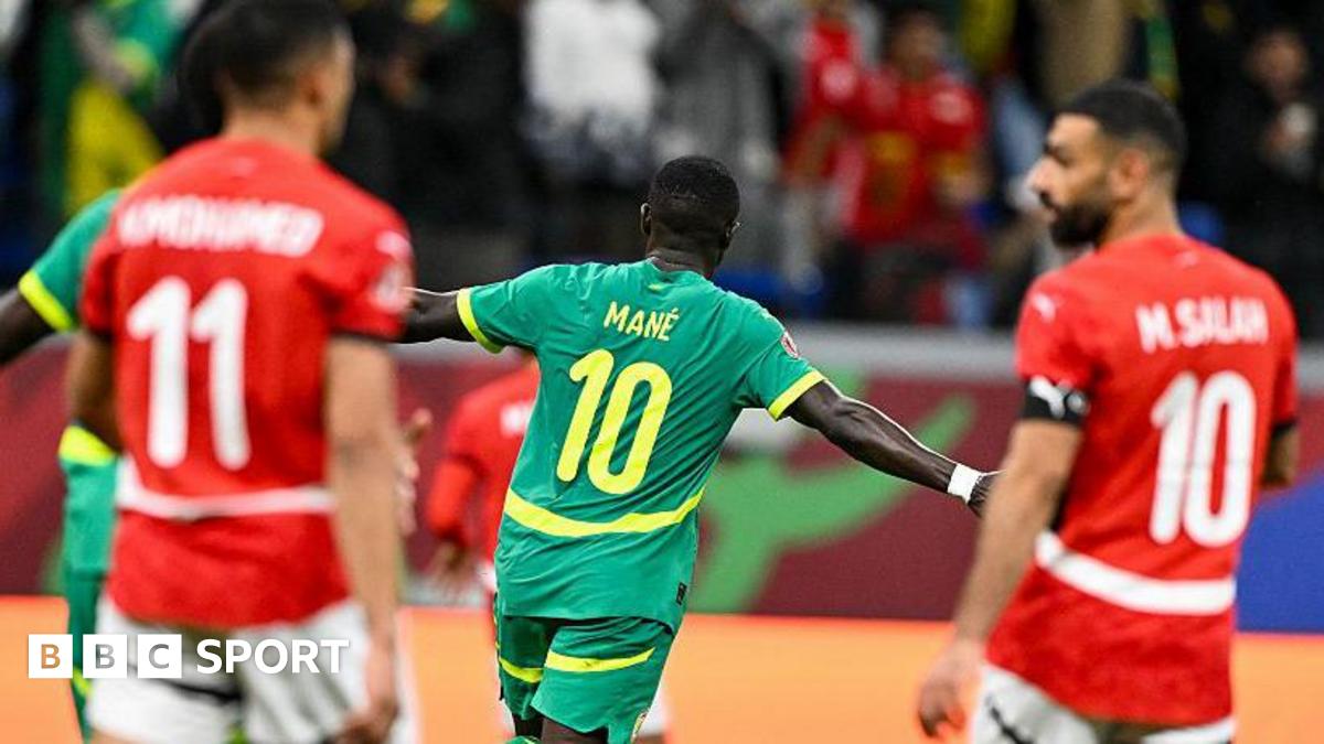 Sadio Mane celebrates scoring against Egypt