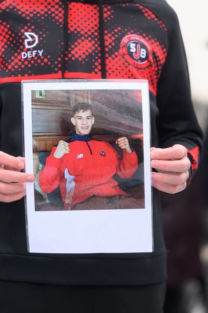 Mourners gather at the family home of Paul “The Irish Drago” McCullagh in Dunmurry as friends, relatives and members of the boxing community pay their final respects following his death on 1 January 2026.Photo: Kirth Ferris / Pacemaker Press