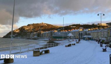 Snow on the ground on Aberystwyth promenade and beach