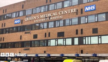 A man walks past a graffiti depicting Venezuelan President Nicolas Maduro in Caracas on January 3, 2026. The colours used in the graffiti are yellow, blue, red and white.