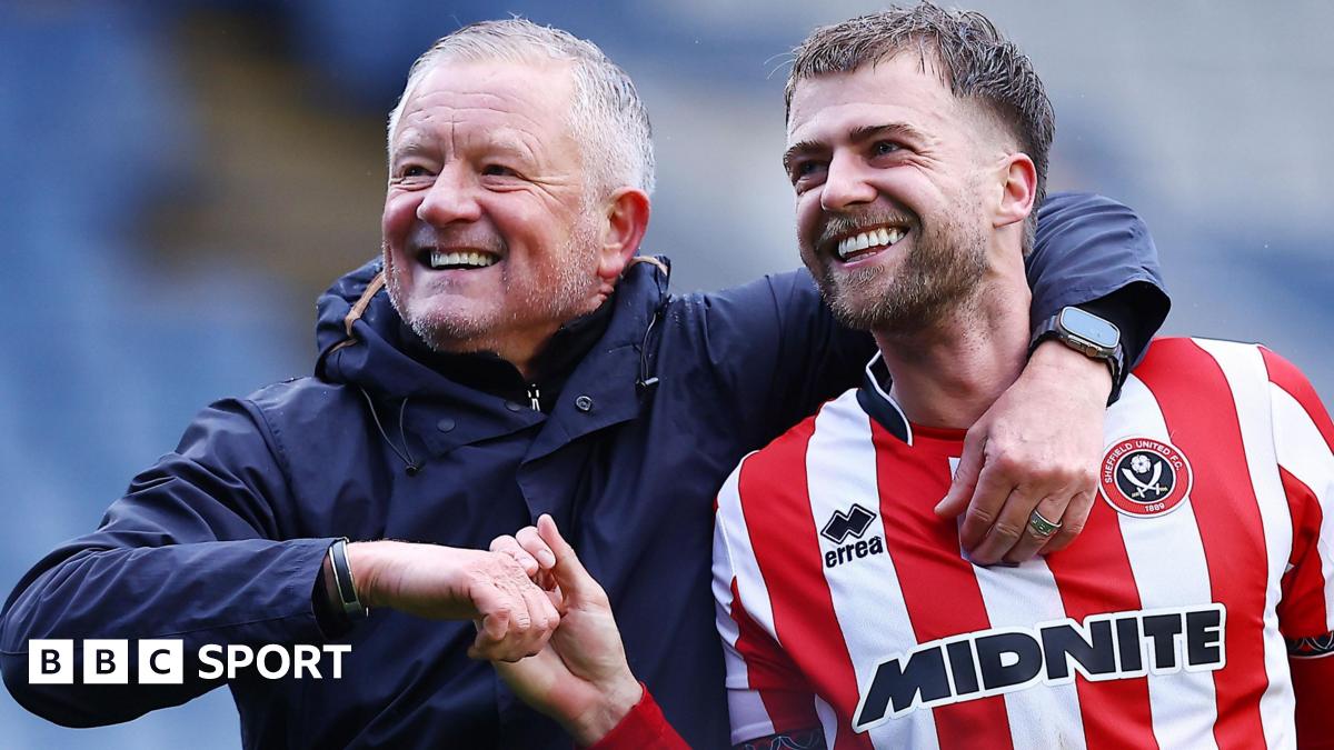 Chris Wilder with his arm round the shoulders of Patrick Bamford